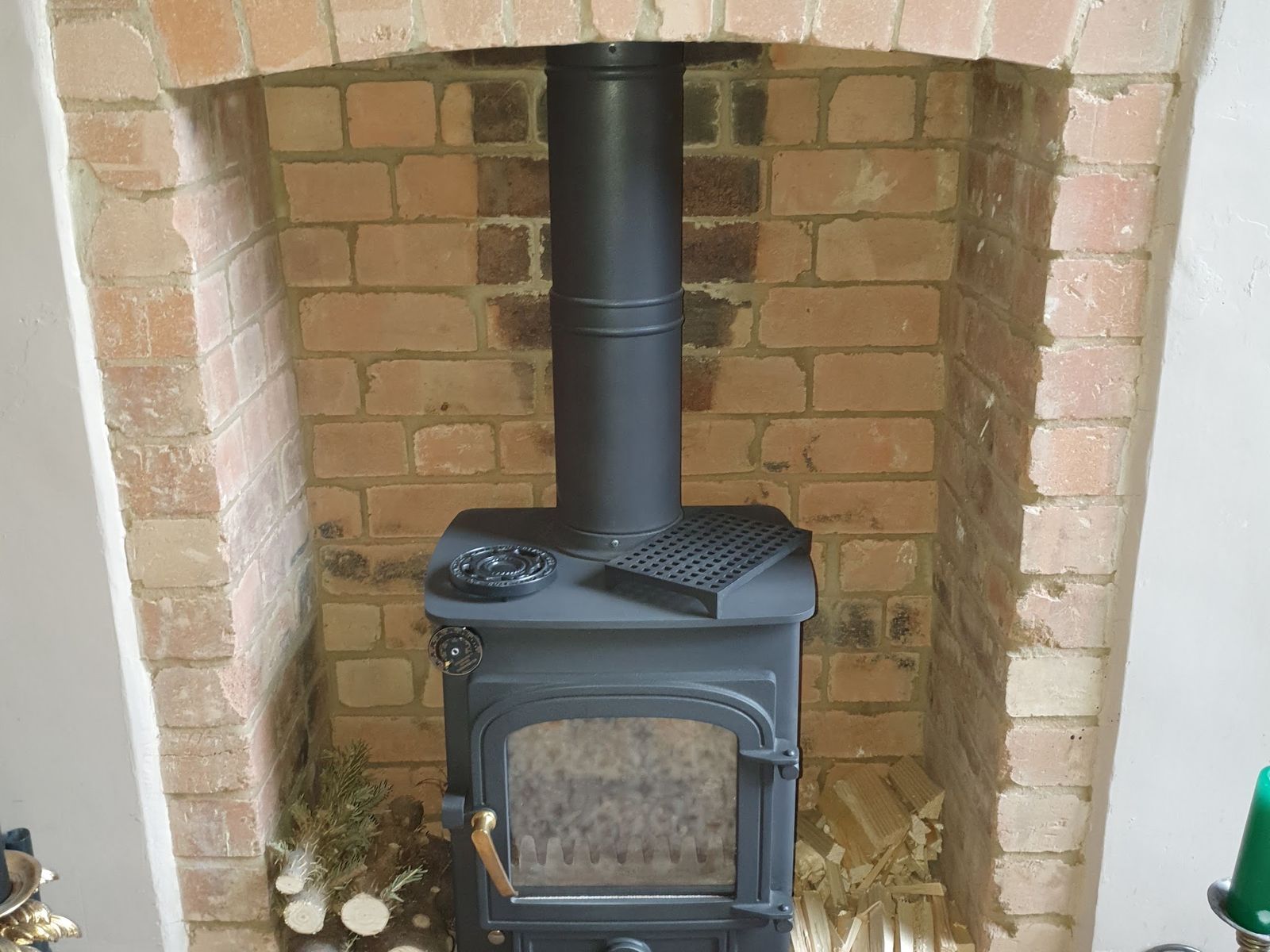 A Clearview Pioneer stove in a brick fireplace