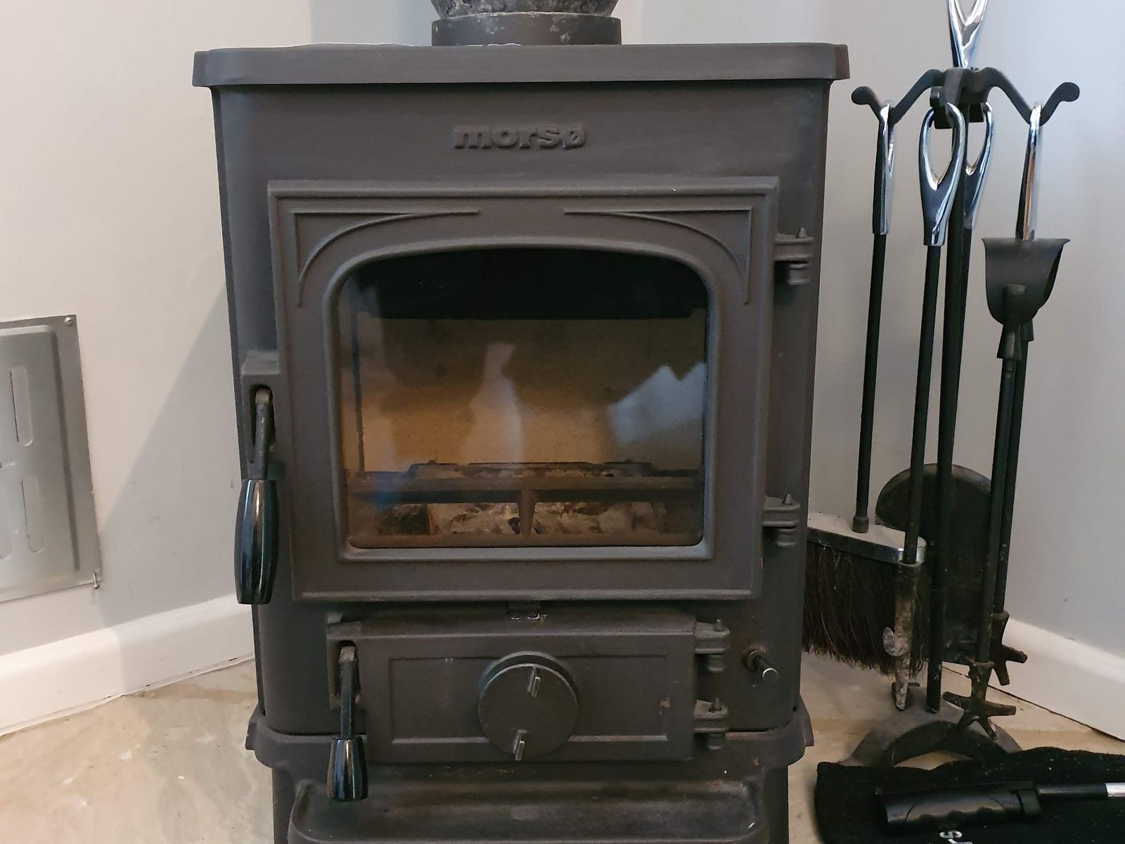 A Morso Squirrel stove with a new brick set