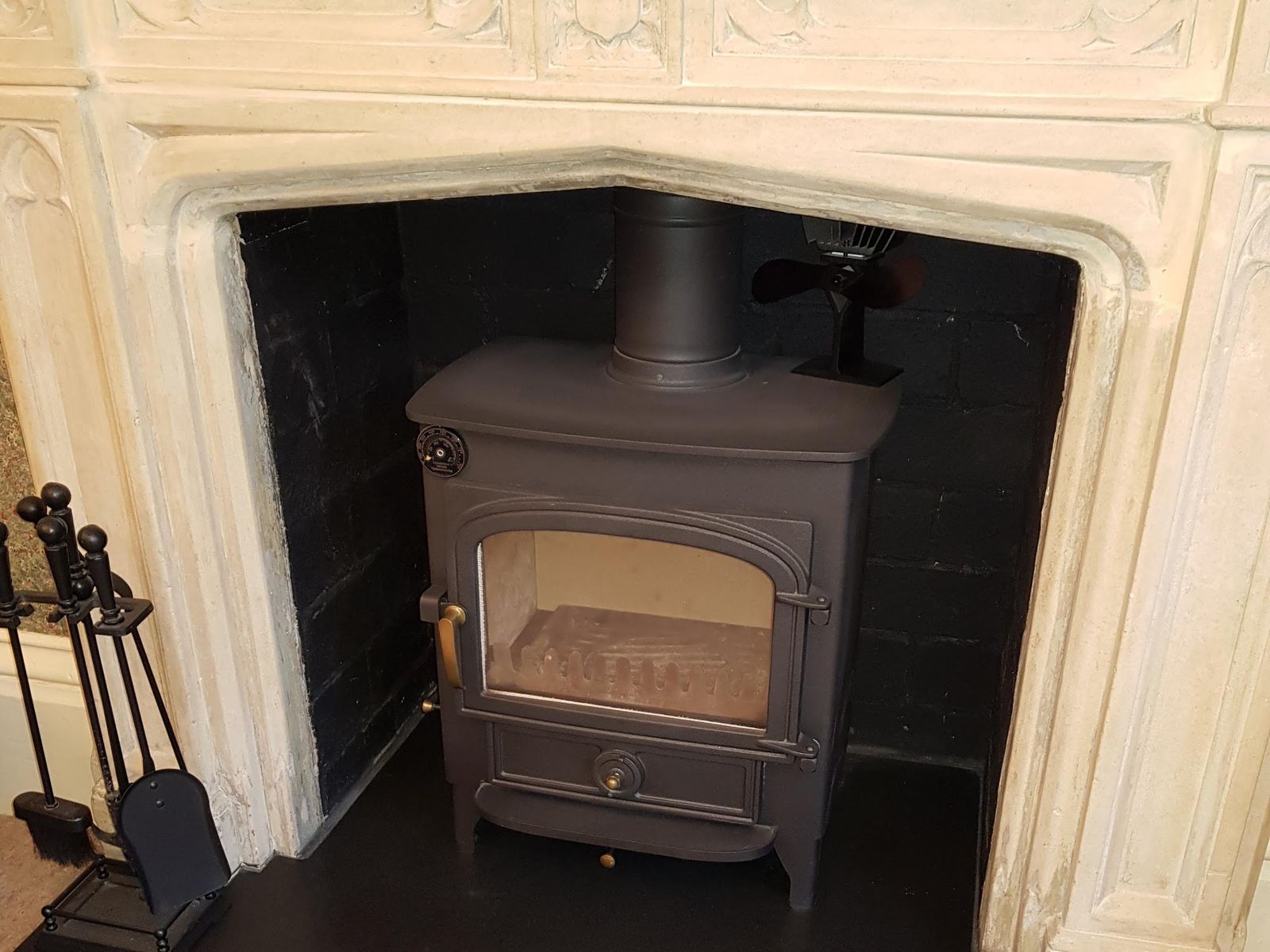 A Clearview Vision 500 in a carved stone fireplace