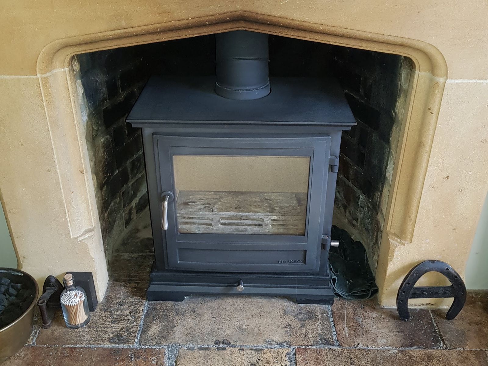 A Chesneys Shipton 8 in a stone fireplace