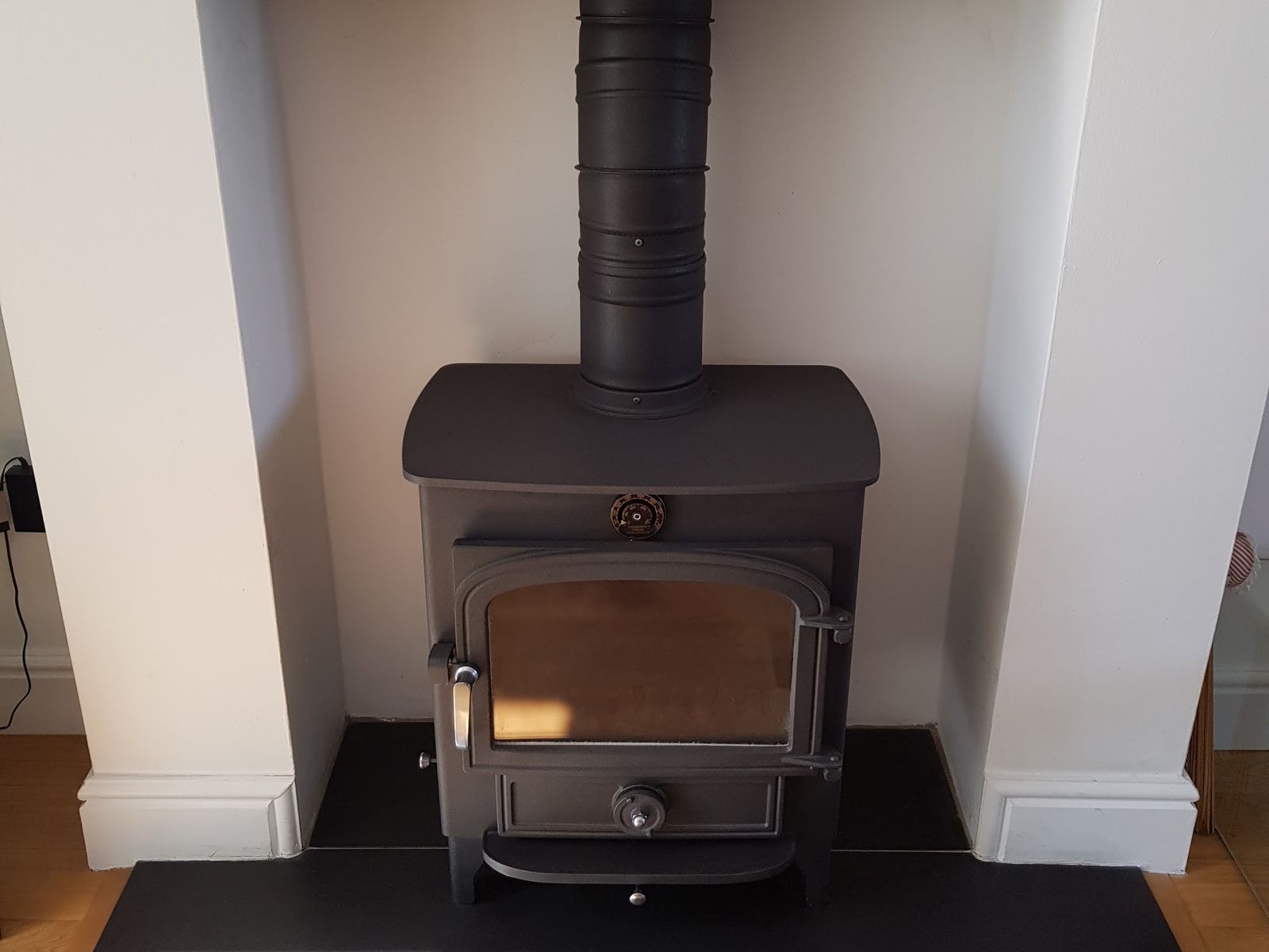A well kept Clearview Vision 500 in a white fireplace