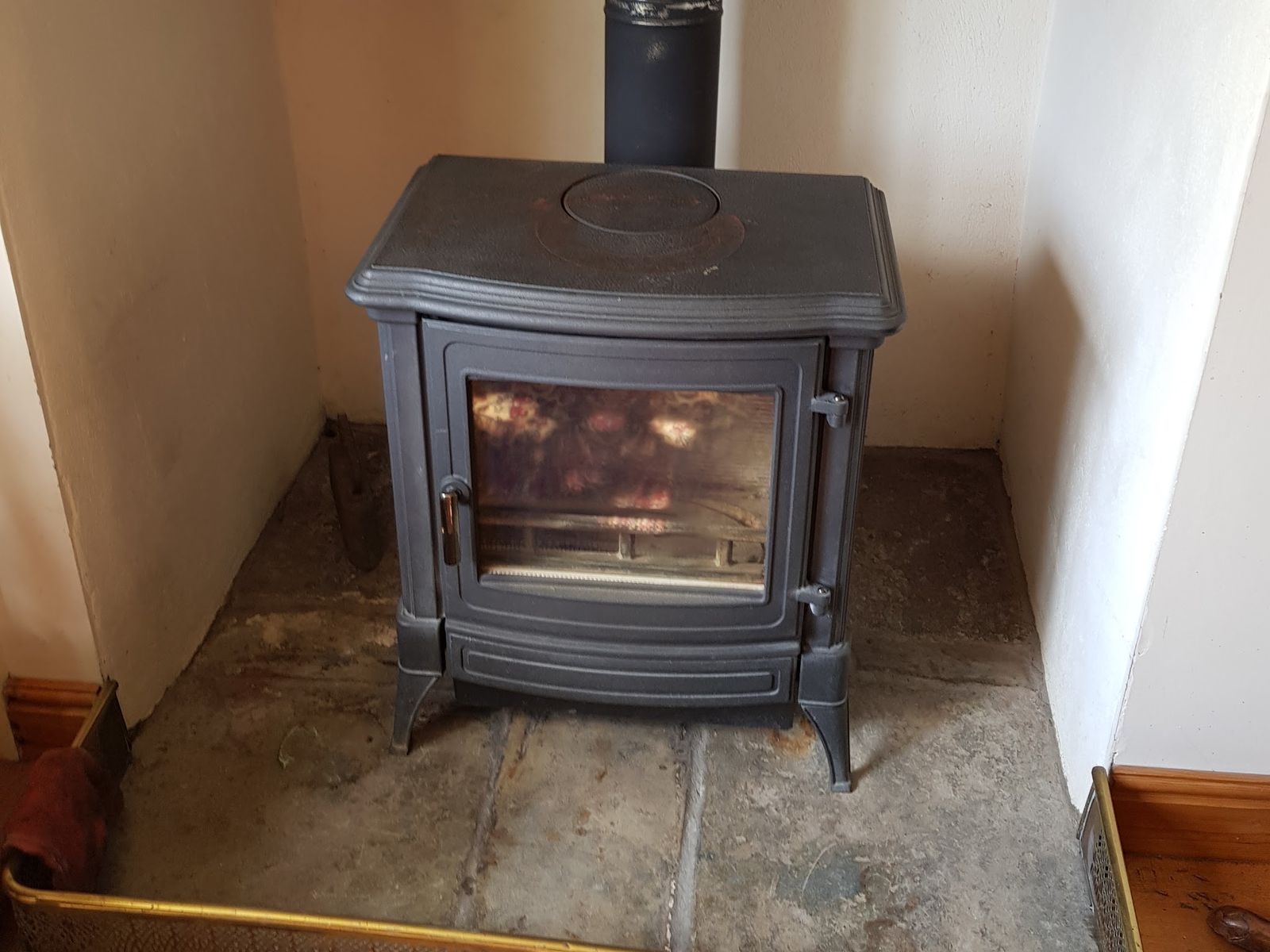 A Stanford stove on a stone hearth